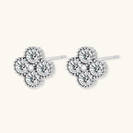 GRA certified moissanite diamond quatrefoil stud earrings in polished 925 sterling silver, angled side view | Olaty