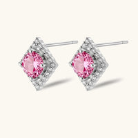 Angled side view of Pink Moissanite Diamond Halo Studs showing round pink moissanite centers and polished sterling silver settings | Olaty