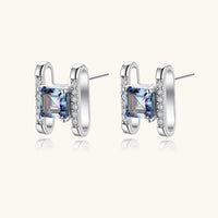 Angled pair of Mystic Moissanite Diamond Prism Square Stud Earrings showing square-cut rainbow stones | Olaty