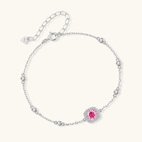 Pink moissanite halo bracelet with bezel set accents in 925 sterling silver angled view | Olaty