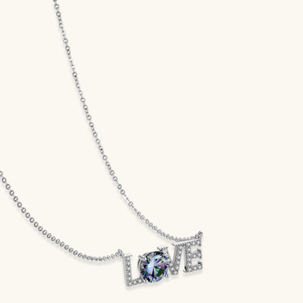 Rainbow moissanite LOVE pendant necklace in polished sterling silver angled product view | Olaty