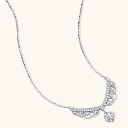 Angled view of GRA Certified Moissanite Diamond Angel Wing Necklace with round drop stone | Olaty