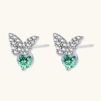 Angled view of Green Moissanite Diamond Butterfly Stud Earrings showing round green stones and butterfly settings | Olaty