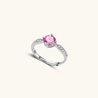Angled view of Pink Dreams Ring showing round pink moissanite and polished adjustable sterling silver band | Olaty