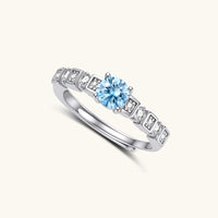 Angled view of GRA Certified Light Blue Moissanite Diamond Skyline Ring with geometric silver setting | Olaty