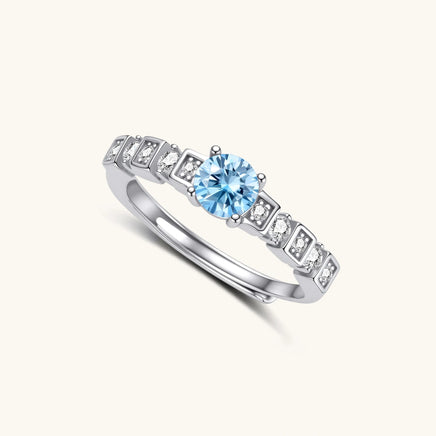 Angled view of GRA Certified Light Blue Moissanite Diamond Skyline Ring with geometric silver setting | Olaty