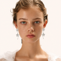 Bloom Cascade sculptural flower drop earrings styled on model front view | Olaty