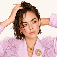 Golden Bow Blossom pearl statement brooch styled on pink blazer with sculptural floral design | Olaty