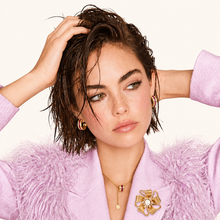Golden Bow Blossom pearl statement brooch styled on pink blazer with sculptural floral design | Olaty