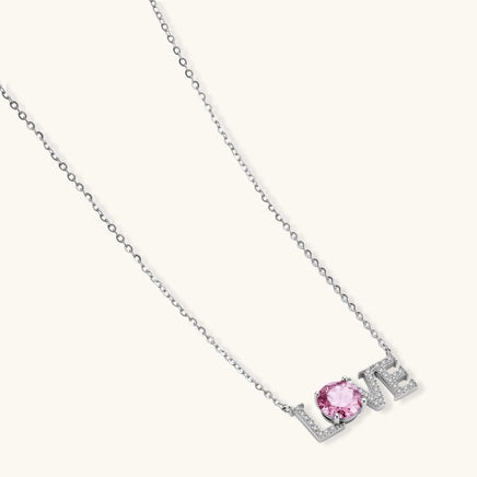 GRA certified pink moissanite LOVE necklace in sterling silver displayed at an angled product view | Olaty