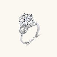 Angled view of Promise Bow Statement Ring with brilliant round moissanite and polished 925 sterling silver band | Olaty