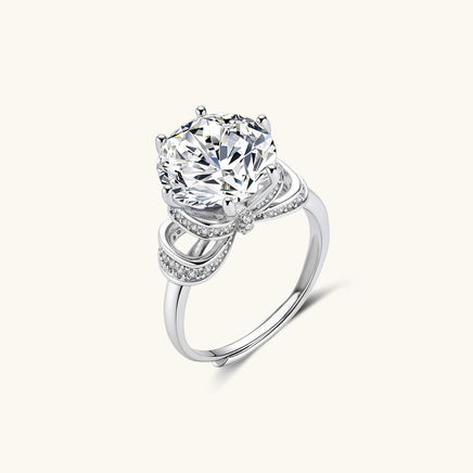 Angled view of Promise Bow Statement Ring with brilliant round moissanite and polished 925 sterling silver band | Olaty