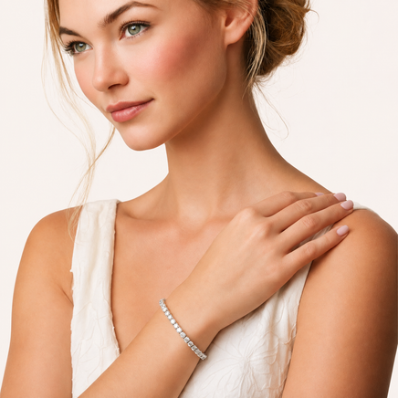 Classic moissanite tennis bracelet worn on wrist with elegant white outfit | Olaty