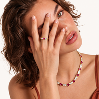 Love + Logic gold heart zirconia ring styled on model with coordinating statement jewelry | Olaty