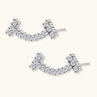Angled view of Moissanite Diamond Cosmic Arc Climber Earrings showing sterling silver setting | Olaty