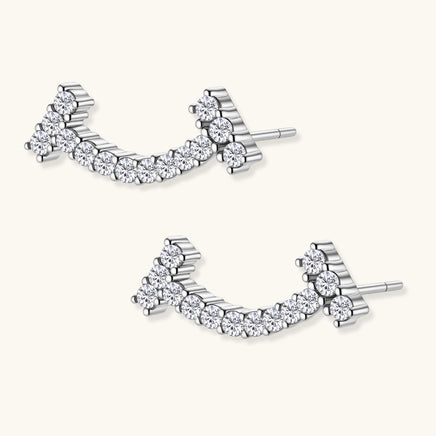 Angled view of Moissanite Diamond Cosmic Arc Climber Earrings showing sterling silver setting | Olaty
