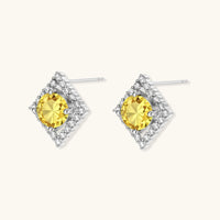 Side angle of Yellow Moissanite Golden Halo Stud Earrings highlighting geometric halo settings and polished silver posts | Olaty