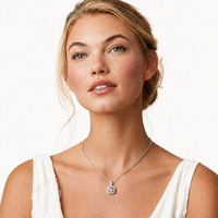 Model wearing GRA Certified Pink Moissanite Diamond Halo Pendant Necklace in sterling silver | Olaty