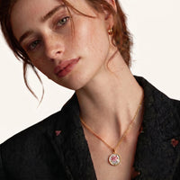 Model wearing rose floral pendant necklace with pink flower and pearl design | Olaty