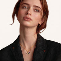 Model wearing delicate colorful floral bouquet pendant necklace with pink and purple flowers | Olaty