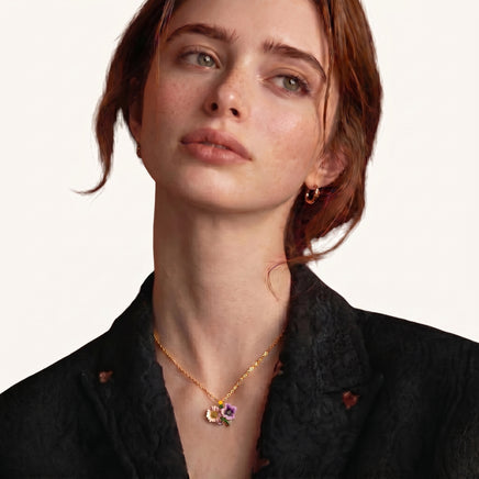 Model wearing delicate colorful floral bouquet pendant necklace with pink and purple flowers | Olaty