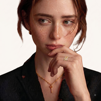 Model wearing two-tone lattice crystal statement ring with geometric openwork design | Olaty