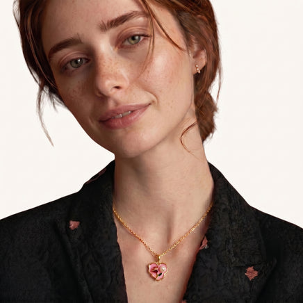 Model wearing pink floral heart pendant necklace with Freshwater Pearl detail | Olaty