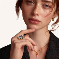 Model wearing Victorian floral cameo statement ring with oval black and white centerpiece | Olaty