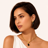 Model wearing Ripple Drop Agate Earrings with black agate and textured gold details | Olaty