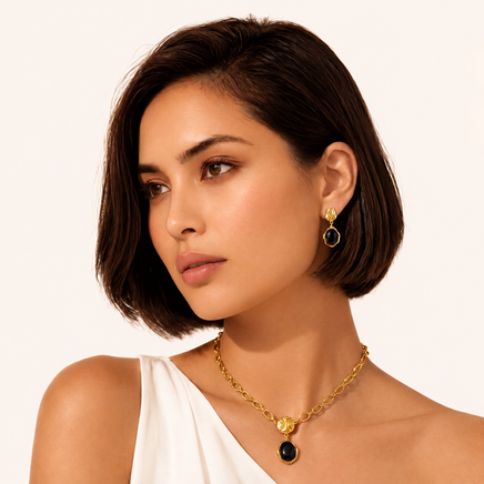 Model wearing Ripple Drop Agate Earrings with black agate and textured gold details | Olaty