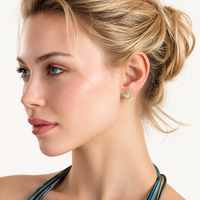 Model wearing Yellow Moissanite Golden Halo Stud Earring with geometric halo design in polished sterling silver | Olaty