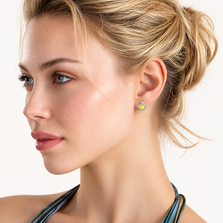 Model wearing Yellow Moissanite Golden Halo Stud Earring with geometric halo design in polished sterling silver | Olaty