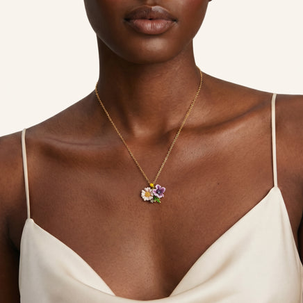 Model wearing colorful flower bouquet pendant necklace with delicate chain and enamel details | Olaty