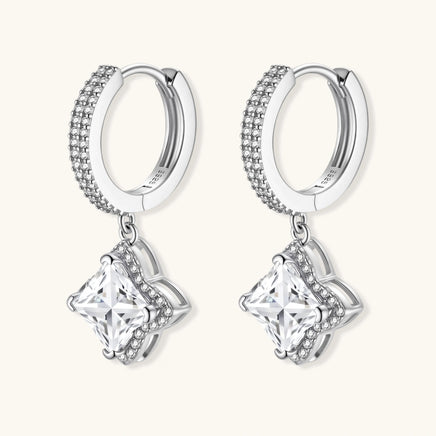 Side angled view of GRA Certified Moissanite Diamond Dangle Huggies showing pavé hoops and drop settings | Olaty