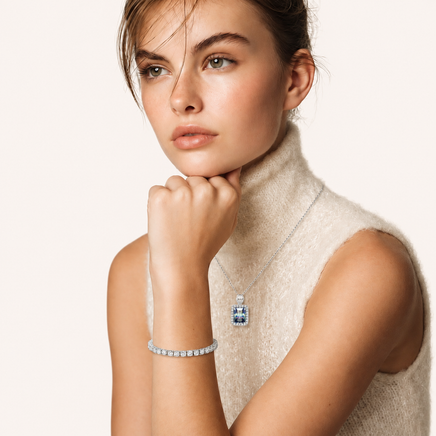 GRA certified moissanite tennis bracelet styled on wrist with polished silver setting | Olaty