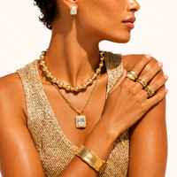 Model wearing emerald cut Zirconia pendant necklace and matching stud earrings | Olaty