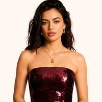 Model wearing champagne zirconia geometric pendant necklace and matching drop huggie earrings | Olaty