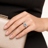 Model wearing Promise Bow Statement Ring with large round moissanite and sculptural sterling silver bow setting | Olaty