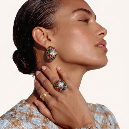 Model wearing multicolor zirconia mosaic statement ring with matching jeweled earrings | Olaty