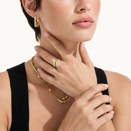 Dual Spark gold-plated adjustable ring styled on model with gold jewelry | Olaty