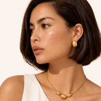 Hammered Gold Huggie Earrings worn on model | Olaty