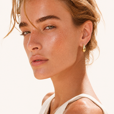 Golden Teardrop sculptural gold stud earring worn on model | Olaty