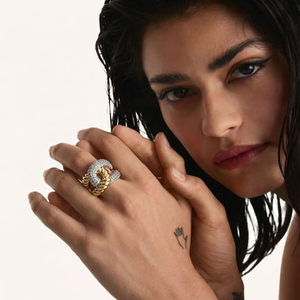 Close-up of model wearing gold-tone chain link statement ring with sparkling zirconia | Olaty