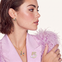 Model wearing rainbow zirconia H initial pendant necklace and matching stud earrings | Olaty
