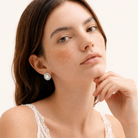 Radiant Pearl Halo statement stud earrings with freshwater pearls styled on model | Olaty