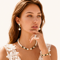 Model wearing Noir pearl necklace, black zirconia bracelet and pearl drop earrings | Olaty