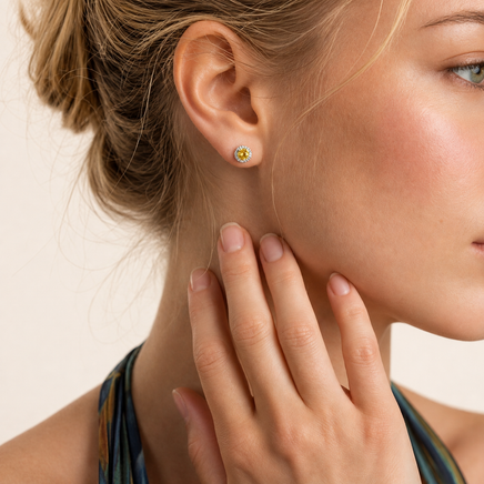 Model wearing Yellow Moissanite Diamond Sunburst Halo Stud Earrings in polished sterling silver | Olaty