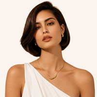 Golden Teardrop gold stud earrings styled on model | Olaty