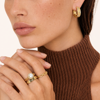 Clover Bloom zirconia hoop earrings in 14K gold-plated eco-brass styled on model | Olaty