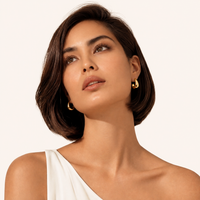 Sculpted Curve Gold Huggie Earrings worn on model | Olaty